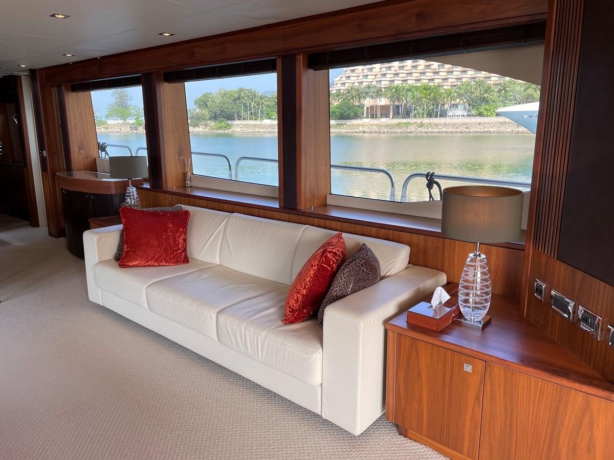 a room with a bed and a window aboard SUNSEEKER 30M Yacht for Sale