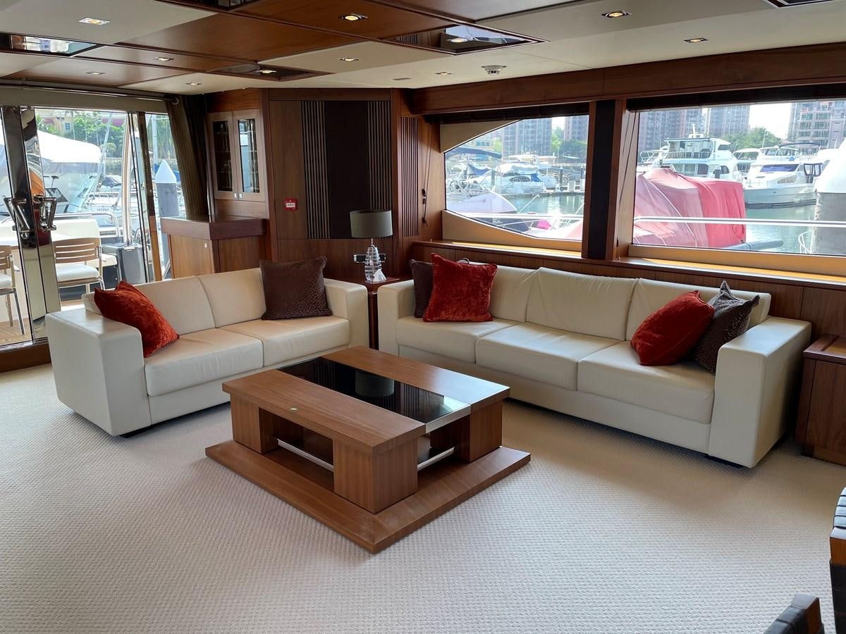 a living room with a couch and a coffee table aboard SUNSEEKER 30M Yacht for Sale