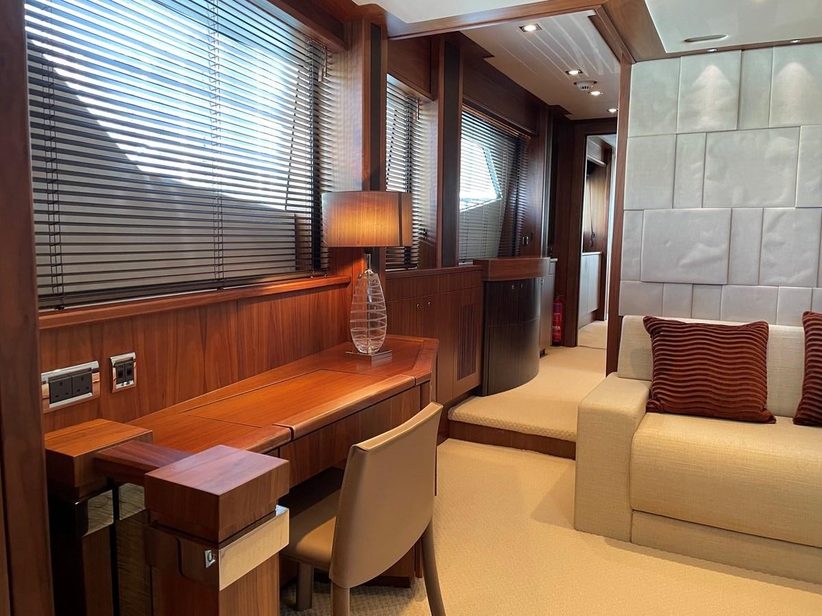 a room with a couch and a table aboard SUNSEEKER 30M Yacht for Sale