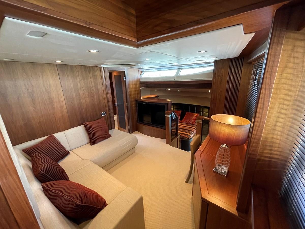 a living room with a couch and a table aboard SUNSEEKER 30M Yacht for Sale