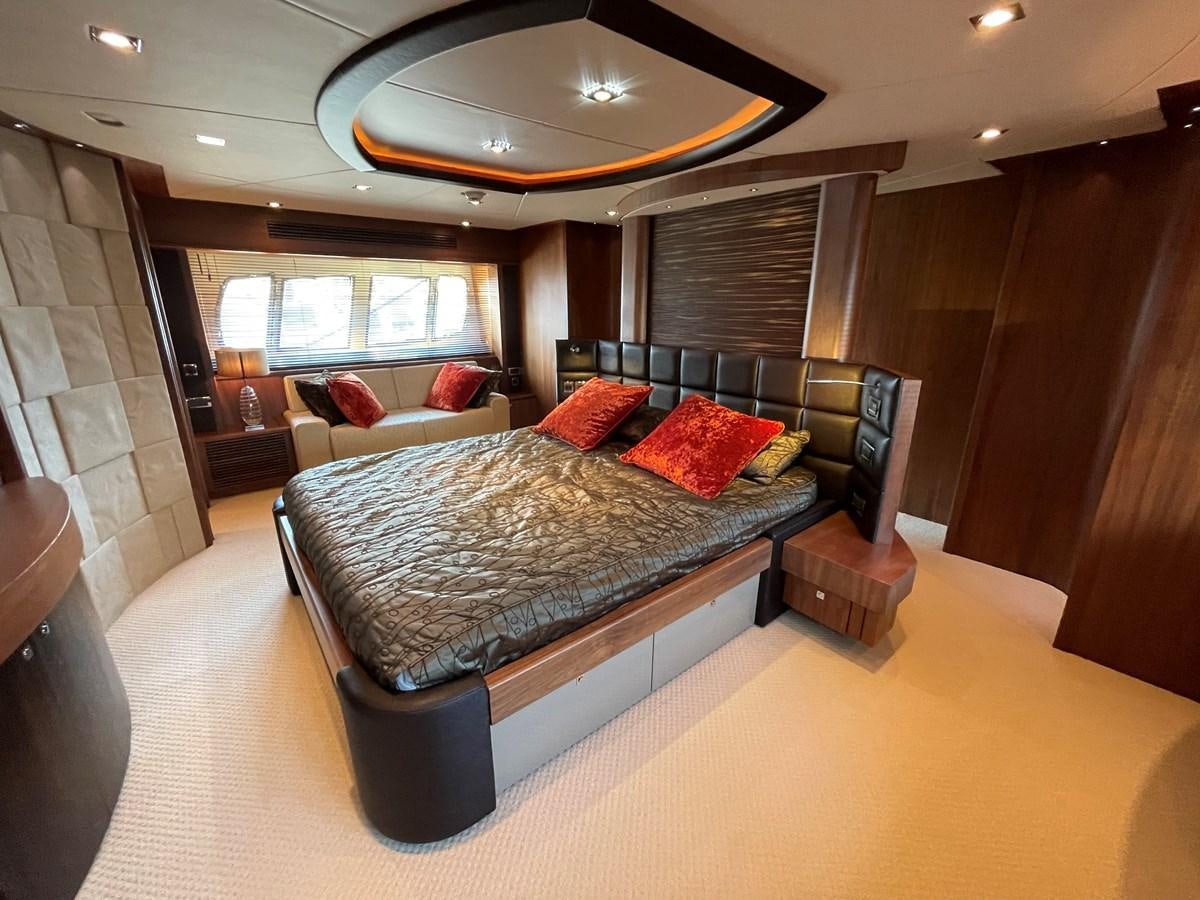 a large bedroom with a large bed aboard SUNSEEKER 30M Yacht for Sale