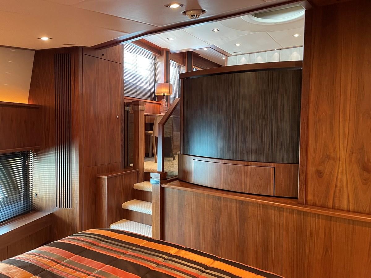 a room with a bed and a desk aboard SUNSEEKER 30M Yacht for Sale