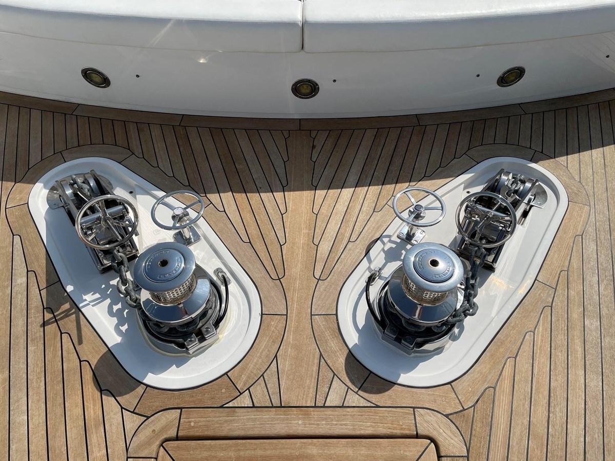 a set of plates on a wooden surface aboard SUNSEEKER 30M Yacht for Sale