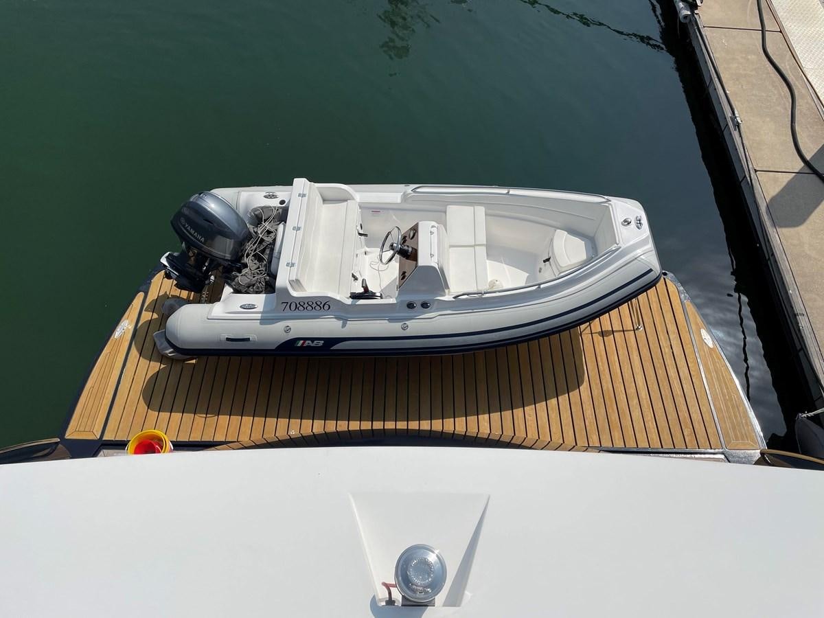 a small white car with a black hood aboard SUNSEEKER 30M Yacht for Sale