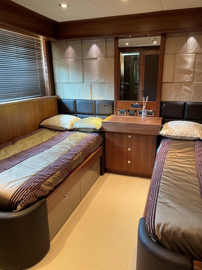 a bedroom with a couple of beds aboard SUNSEEKER 30M Yacht for Sale