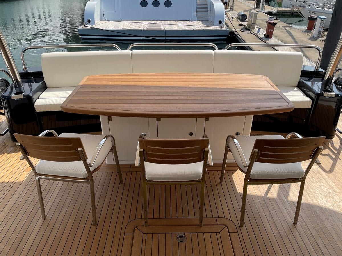 a table and chairs on a deck aboard SUNSEEKER 30M Yacht for Sale