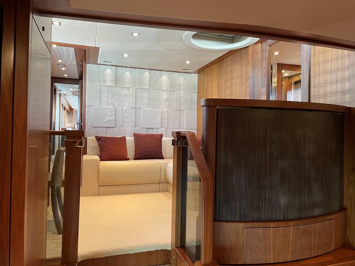 a room with a couch and a television aboard SUNSEEKER 30M Yacht for Sale