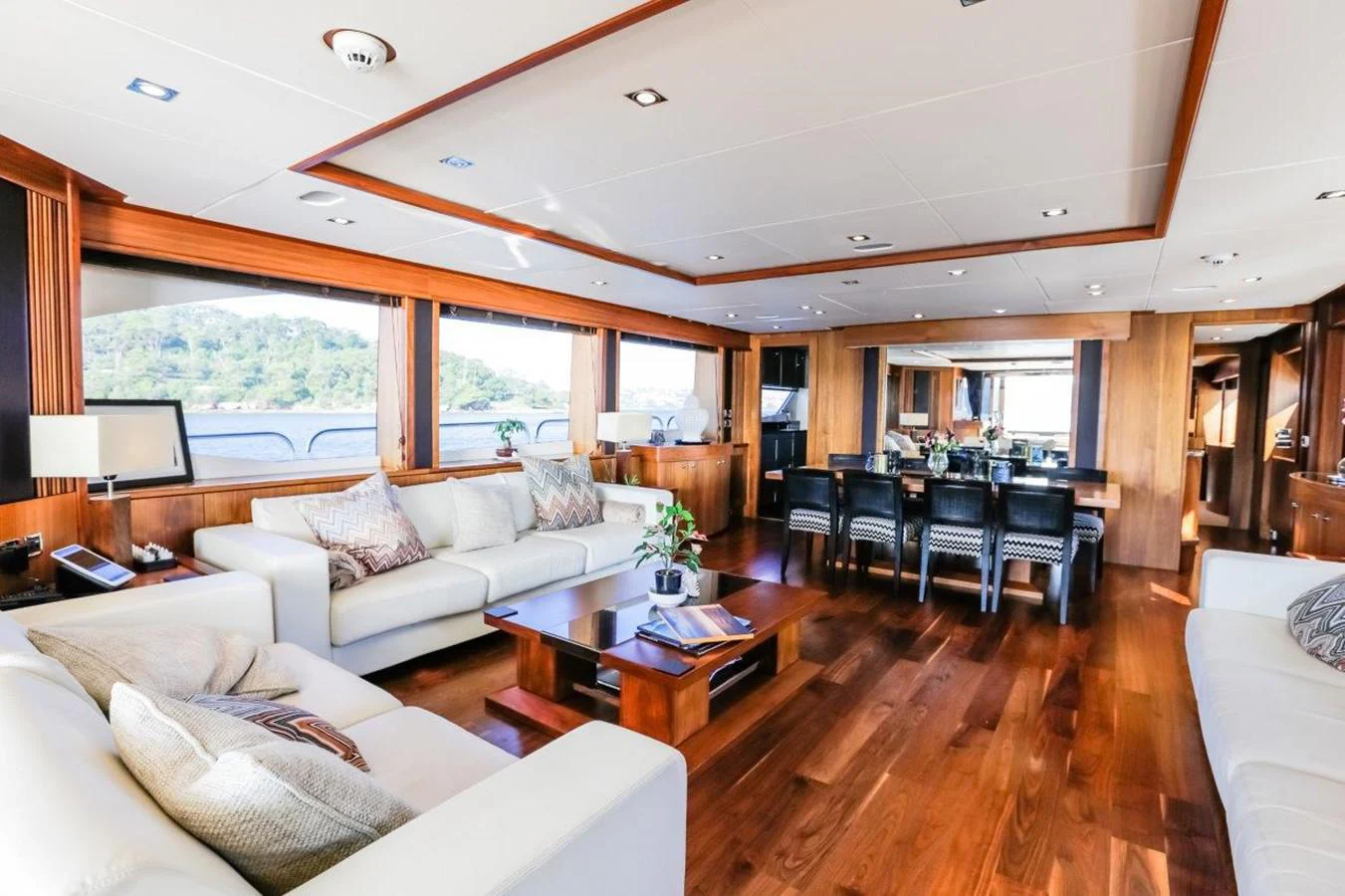 a living room with a large window aboard COLETTE Yacht for Sale