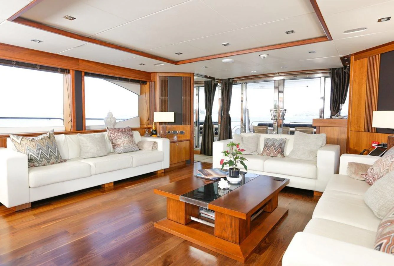 a living room with a large window aboard COLETTE Yacht for Sale