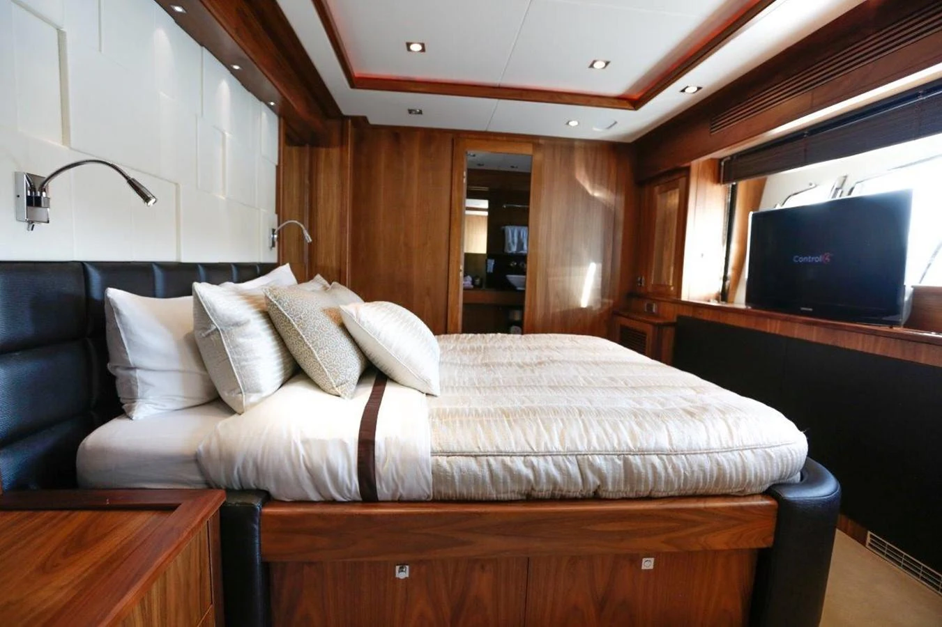 a bed with white sheets aboard COLETTE Yacht for Sale