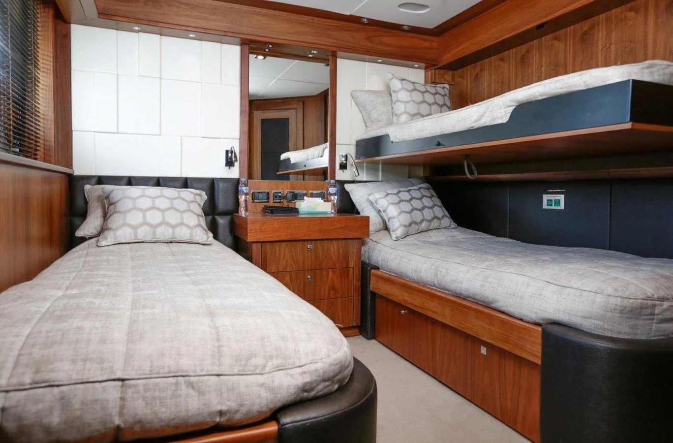 a room with a bed and a mirror aboard COLETTE Yacht for Sale