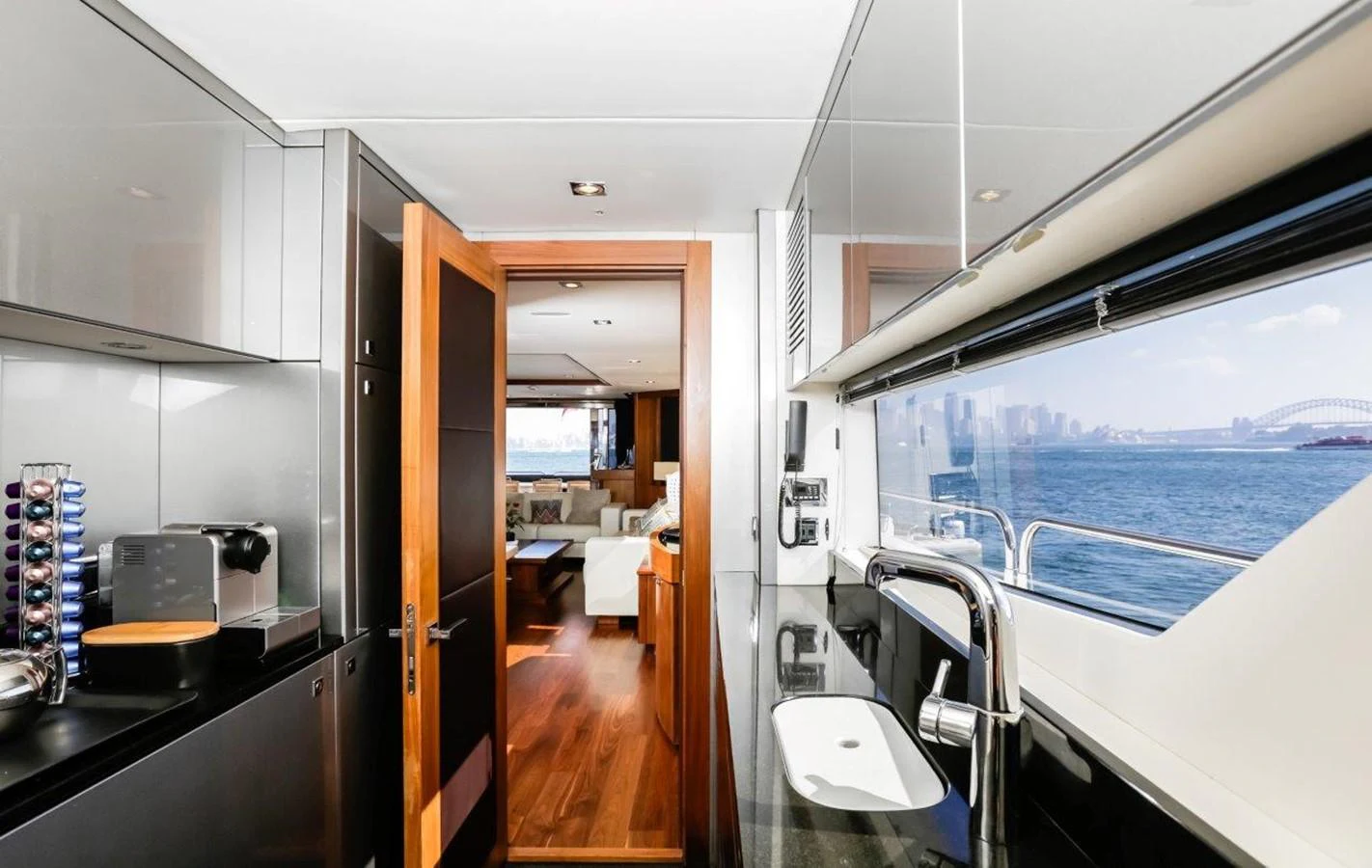 a room with a view of the ocean and the deck aboard COLETTE Yacht for Sale