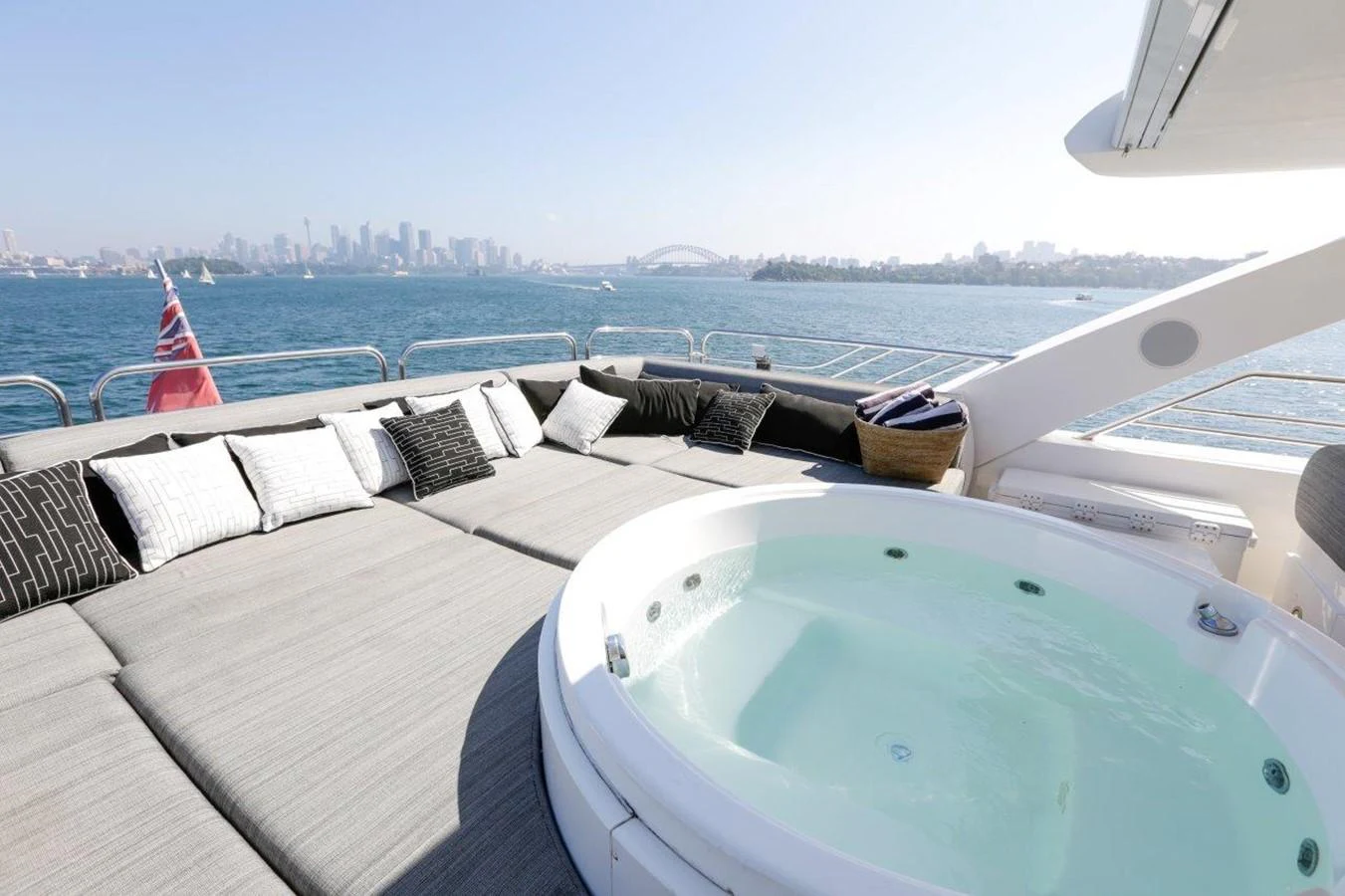 a pool on a deck overlooking a city aboard COLETTE Yacht for Sale