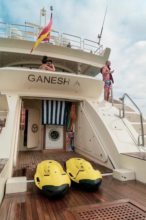 a boat with a person on the deck aboard GANESH A Yacht for Sale