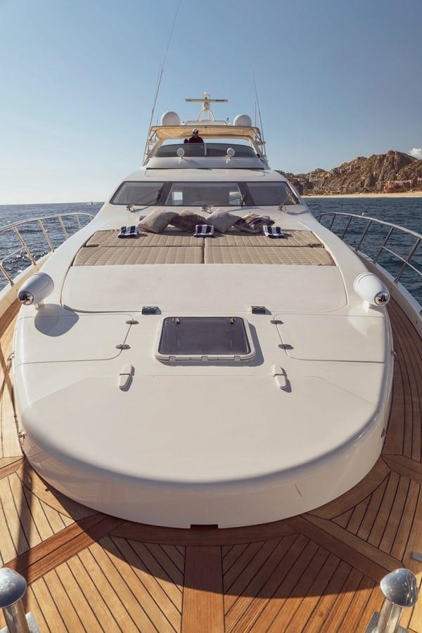 a white yacht on a dock aboard GANESH A Yacht for Sale