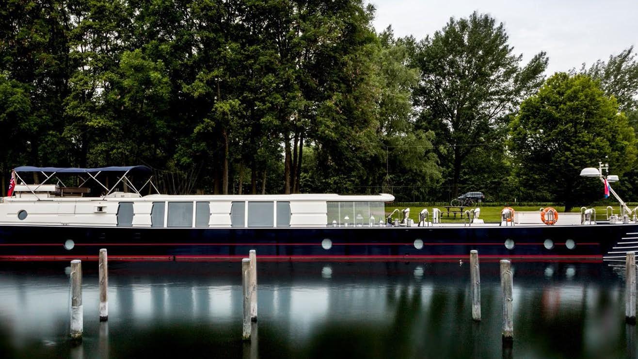 a boat on a body of water aboard BARGE SAVVY Yacht for Sale