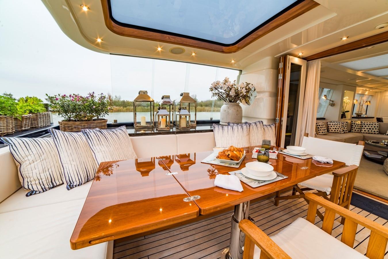 a restaurant with tables and chairs aboard BARGE SAVVY Yacht for Sale