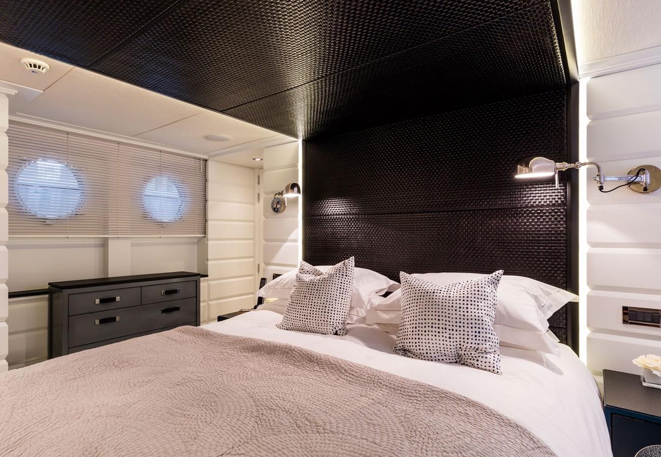 a bed with pillows aboard BARGE SAVVY Yacht for Sale