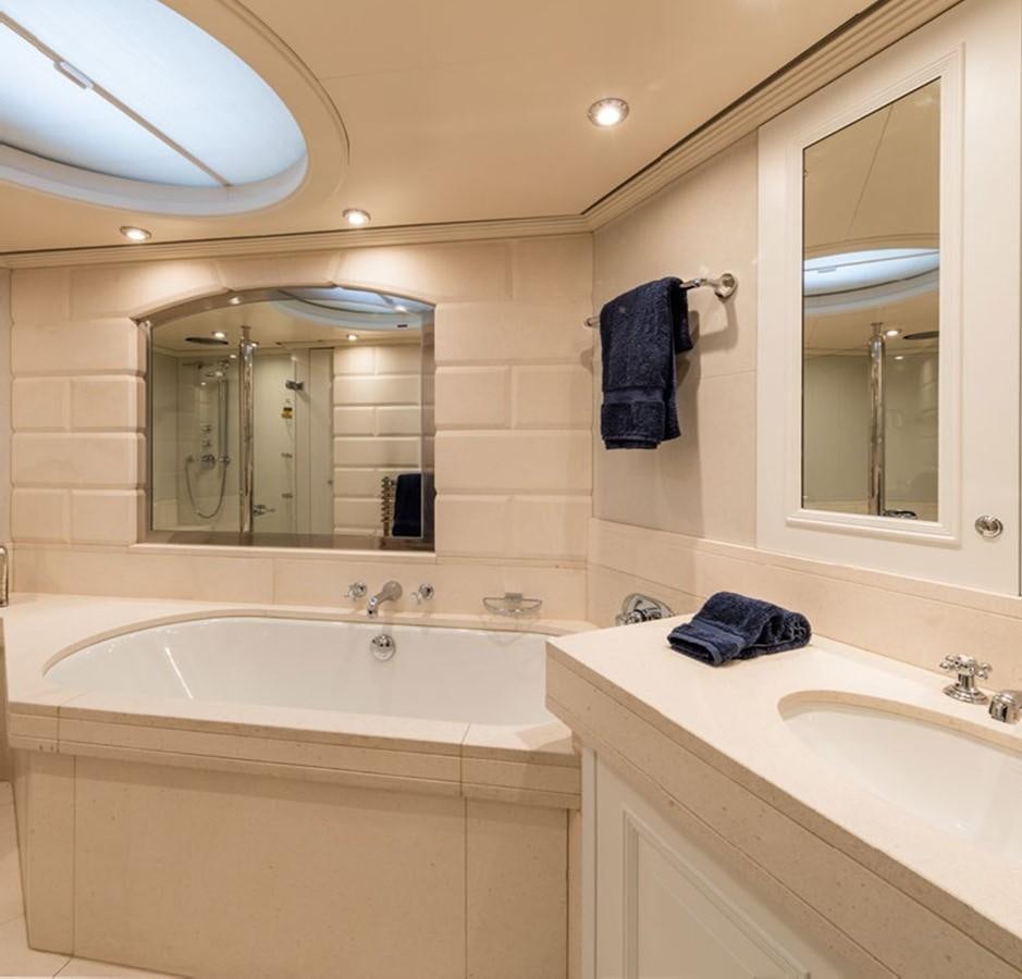 a bathroom with a large mirror aboard BARGE SAVVY Yacht for Sale
