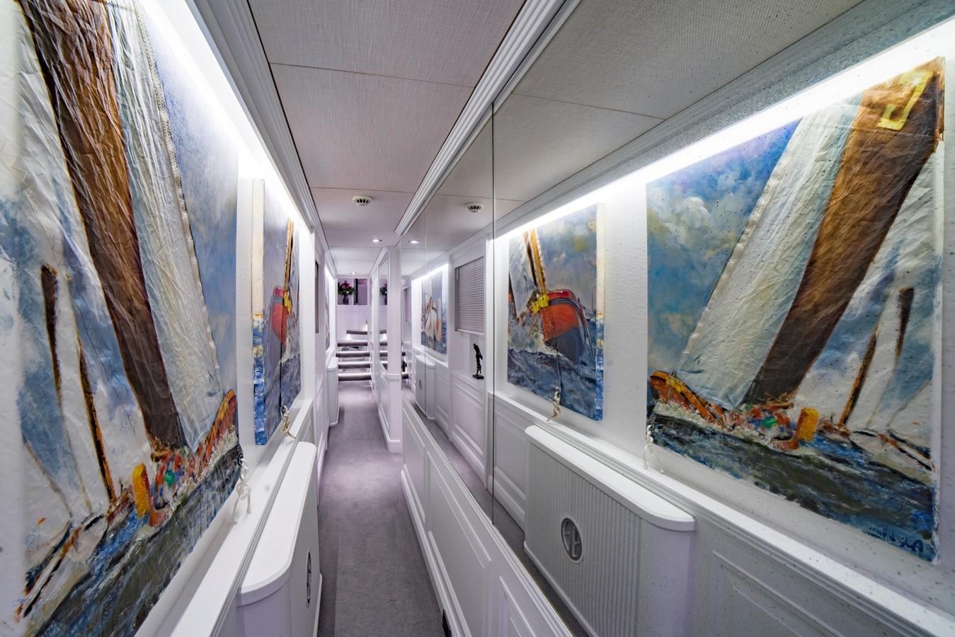 a hallway with glass walls aboard BARGE SAVVY Yacht for Sale