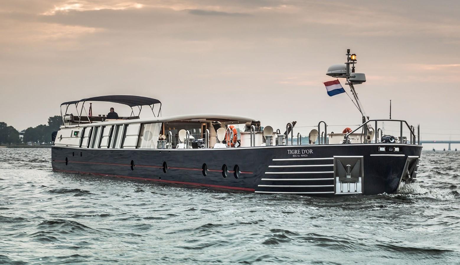 a boat on the water aboard BARGE SAVVY Yacht for Sale