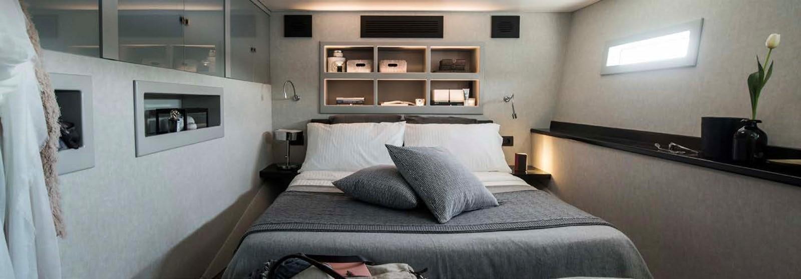 a bed in a room aboard JAMADHAR Yacht for Sale