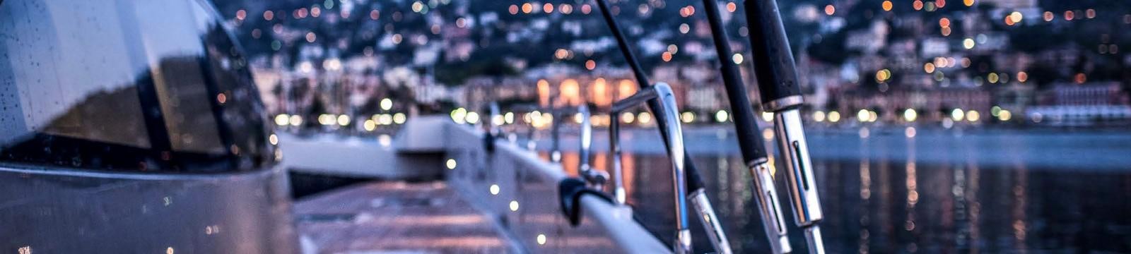 a view of a city at night aboard JAMADHAR Yacht for Sale