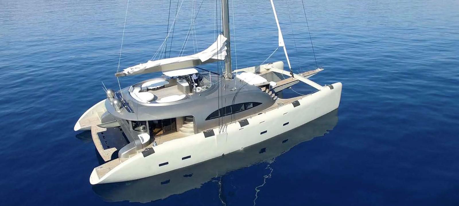 a white boat on the water aboard JAMADHAR Yacht for Sale