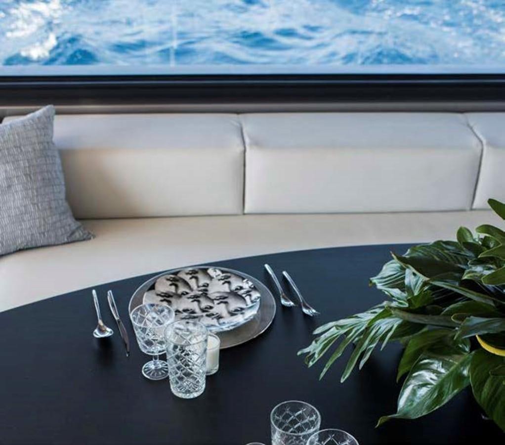 a table with silverware and a plate of food on it aboard JAMADHAR Yacht for Sale