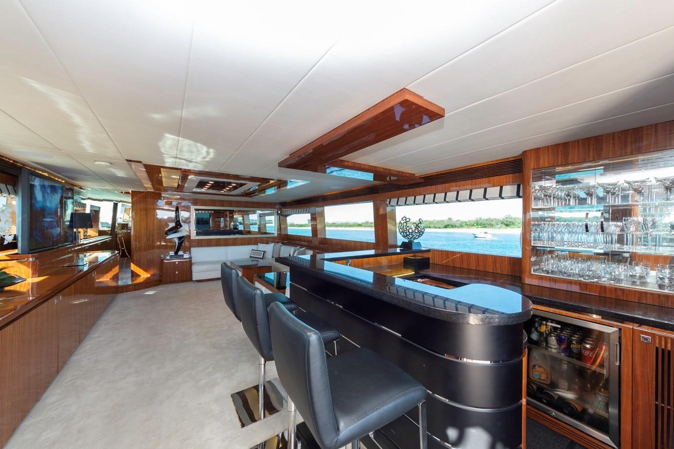a room with a pool table and chairs aboard SUMMER WIND Yacht for Sale