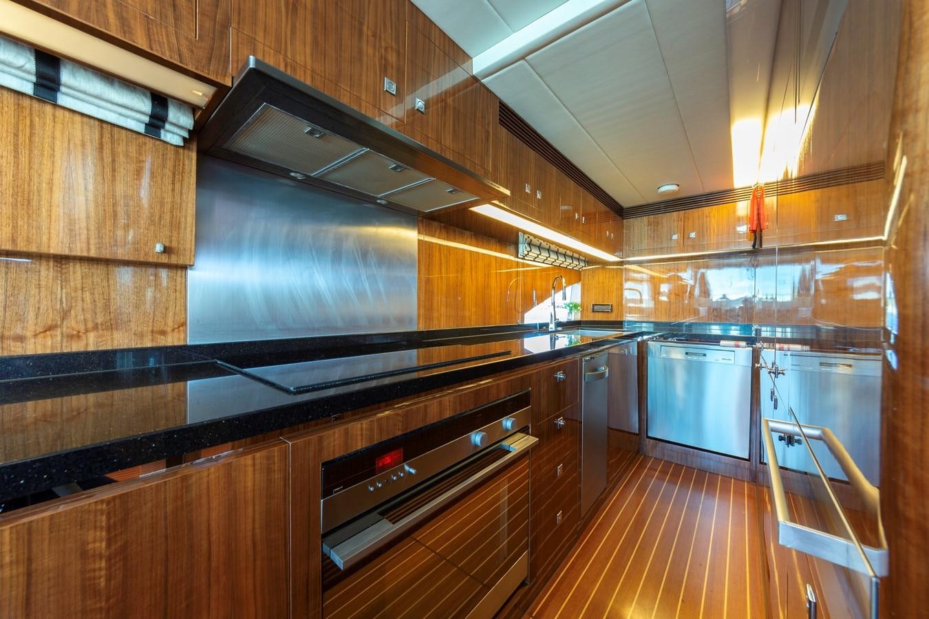 a kitchen with wooden cabinets aboard SUMMER WIND Yacht for Sale