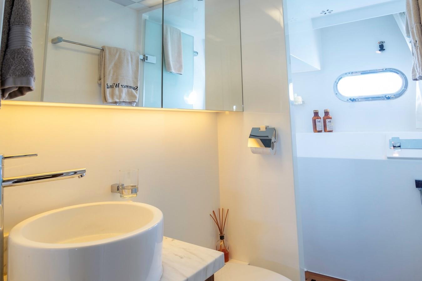 a bathroom with a sink and a toilet aboard SUMMER WIND Yacht for Sale