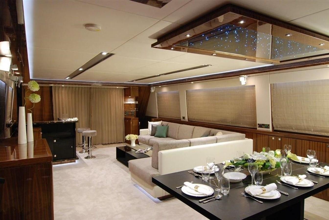 a large living room with a table and chairs aboard RP100 (NEW BOAT SPEC)  Yacht for Sale