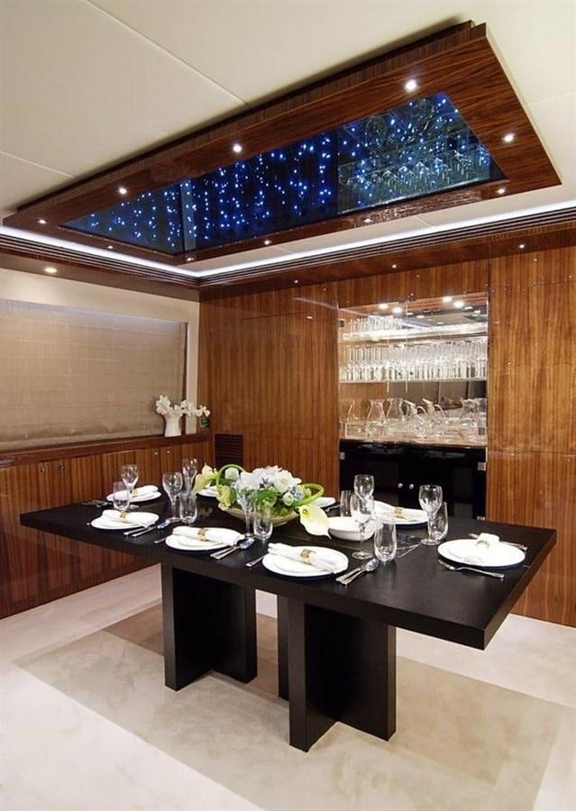 a dining table with plates and glasses aboard RP100 (NEW BOAT SPEC)  Yacht for Sale