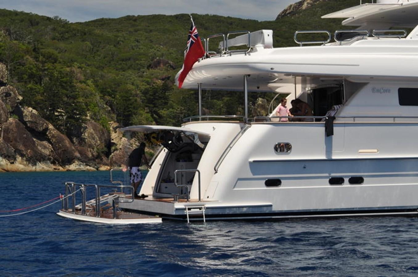 a boat with a flag on the front aboard RP100 (NEW BOAT SPEC)  Yacht for Sale