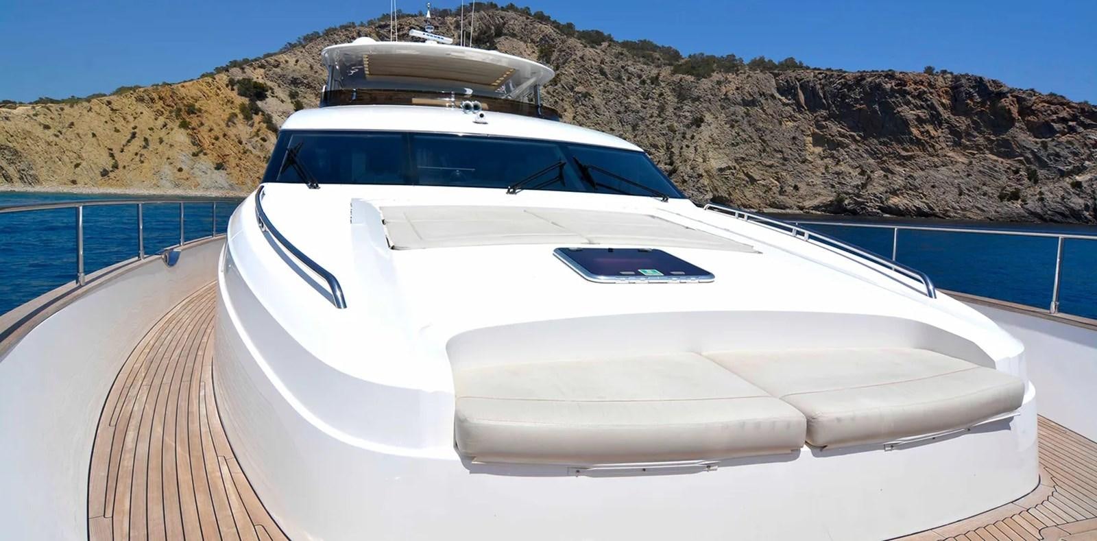 a white boat on a body of water aboard PRINCESS 95 Yacht for Sale