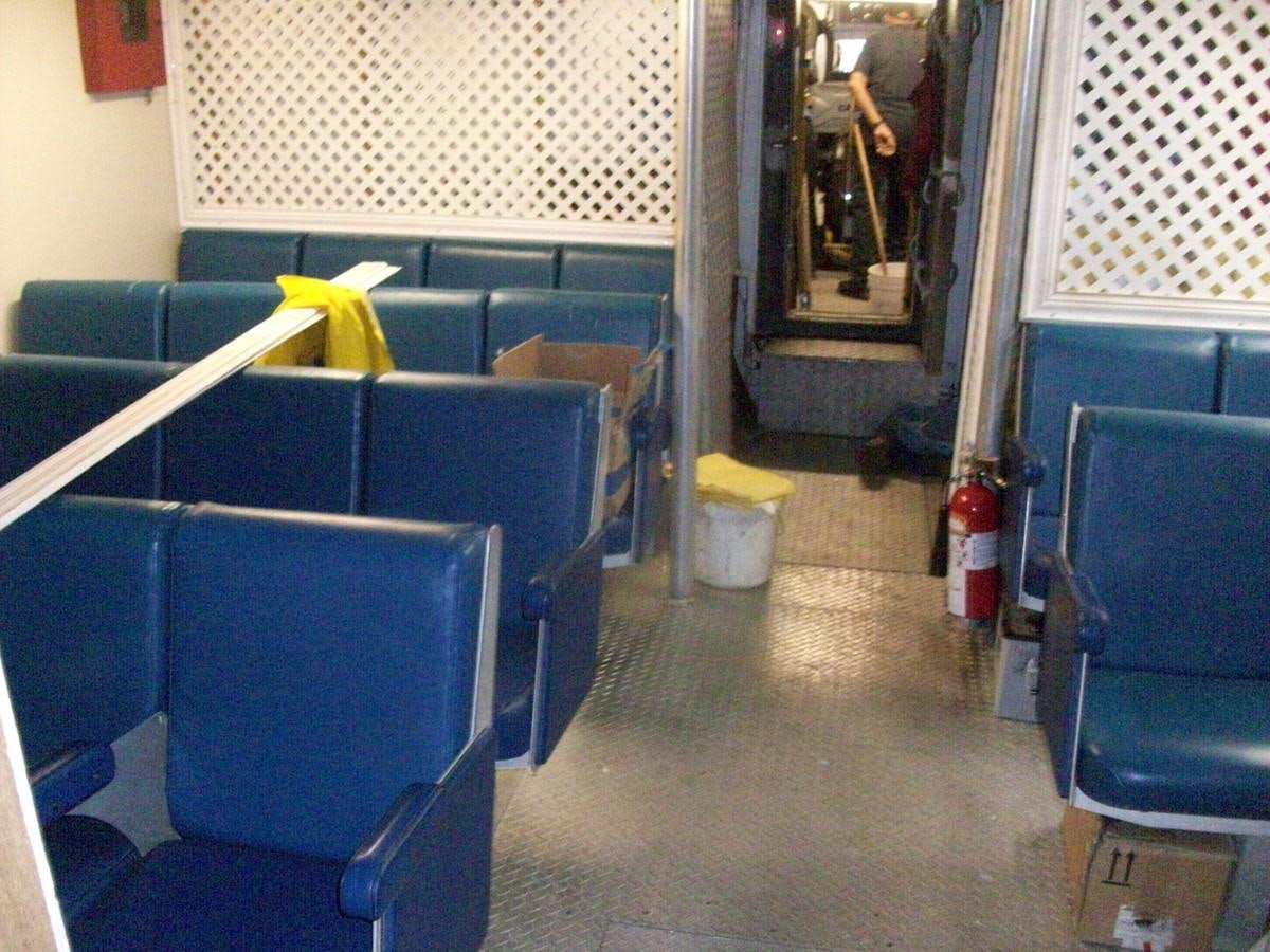 a room with blue chairs and a fire extinguisher aboard NO NAME HALF MOON CLIPPER Yacht for Sale