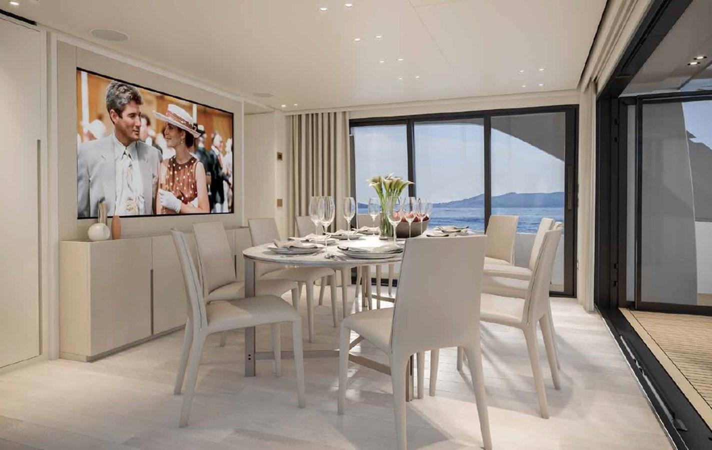 a dining room table with a painting on the wall aboard CLIC Yacht for Sale