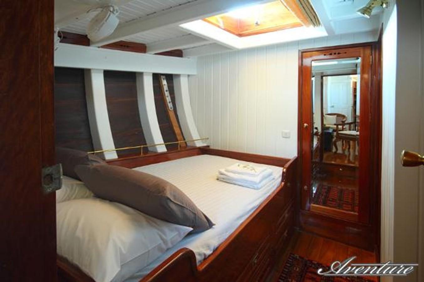 a bed in a room aboard 95FT 2011 CUSTOM KETCH CLASSIC YACHT Yacht for Sale