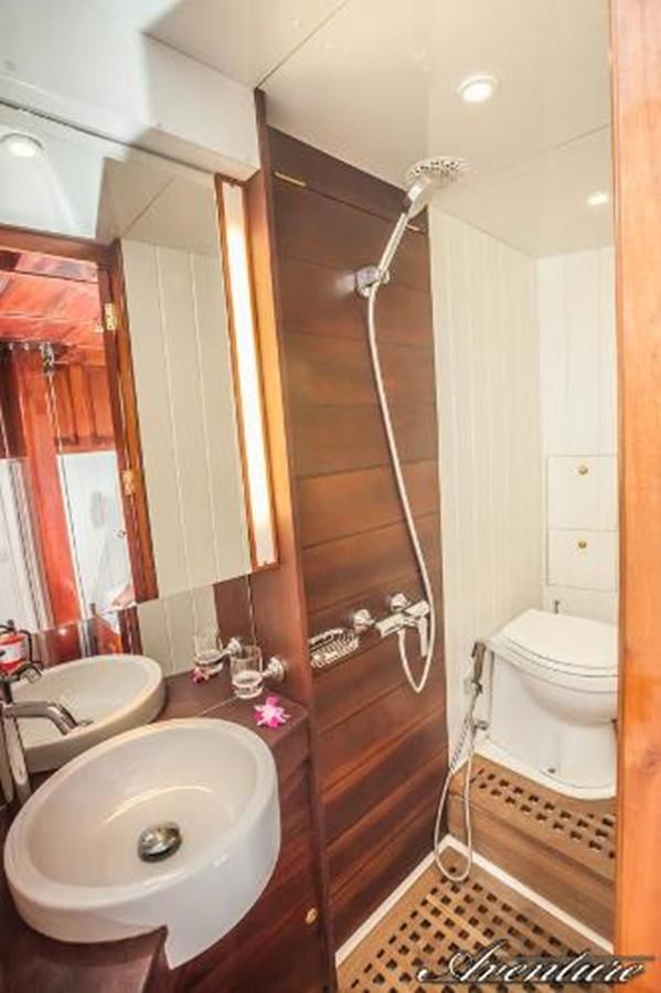 a bathroom with a sink and a toilet aboard 95FT 2011 CUSTOM KETCH CLASSIC YACHT Yacht for Sale