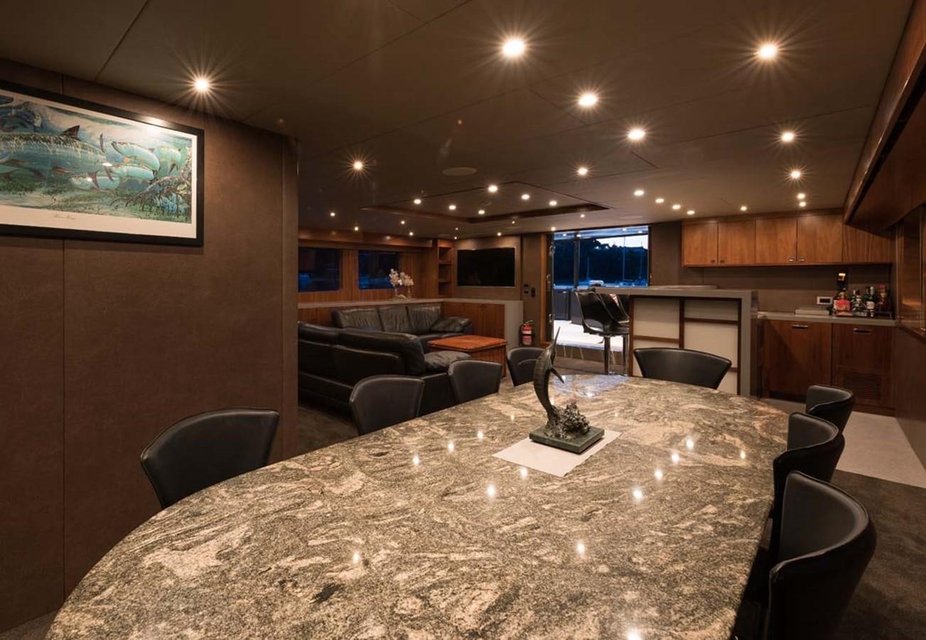 a large dining room with a large table and chairs aboard PACIFIC HQ Yacht for Sale
