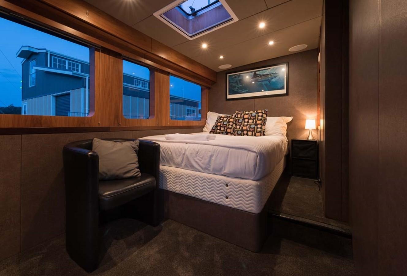 a bed in a room aboard PACIFIC HQ Yacht for Sale
