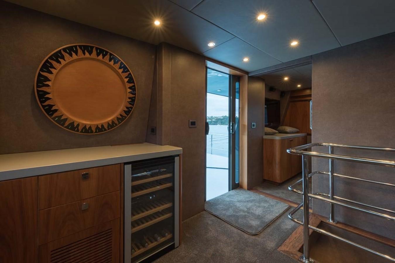 a room with a large window and a large door aboard PACIFIC HQ Yacht for Sale