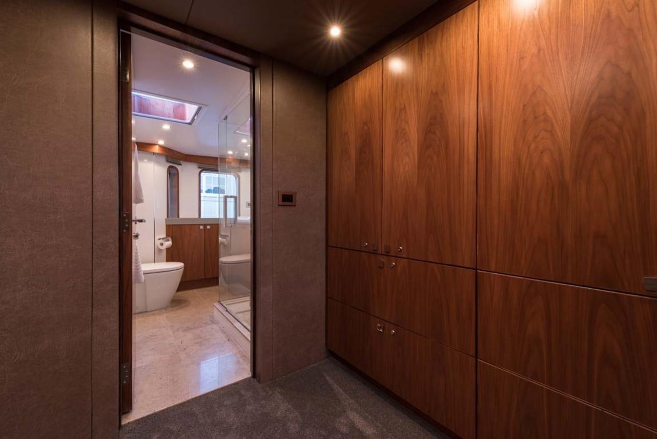 a bathroom with wooden cabinets aboard PACIFIC HQ Yacht for Sale