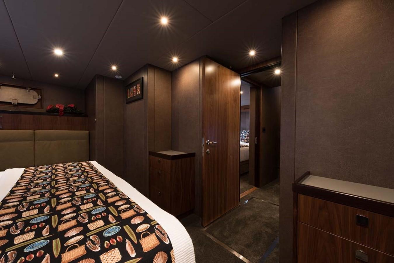 a room with a bed and a desk aboard PACIFIC HQ Yacht for Sale