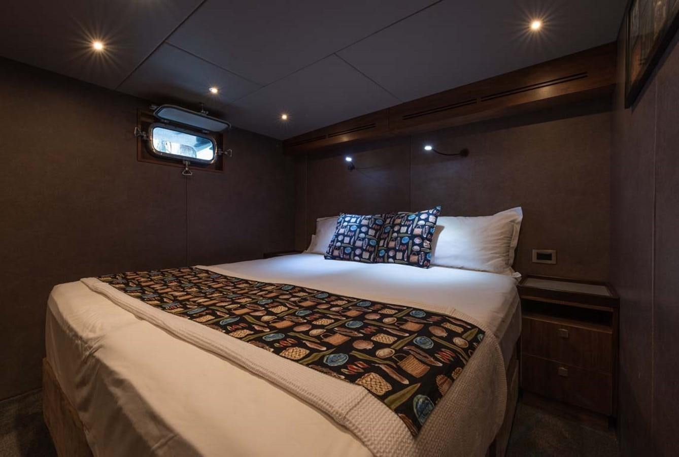 a bed with a pillow on it aboard PACIFIC HQ Yacht for Sale