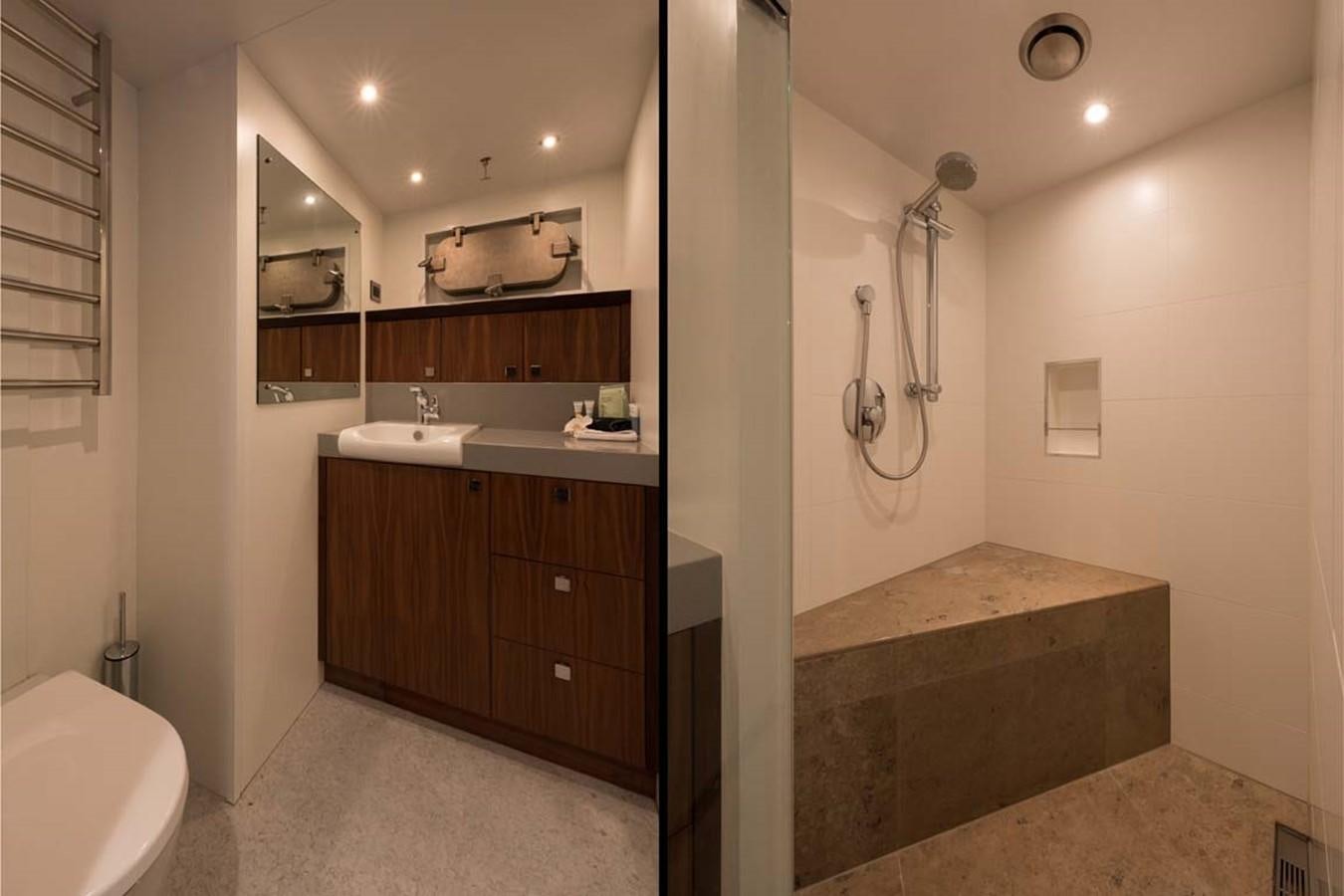 a bathroom with a sink and a toilet aboard PACIFIC HQ Yacht for Sale