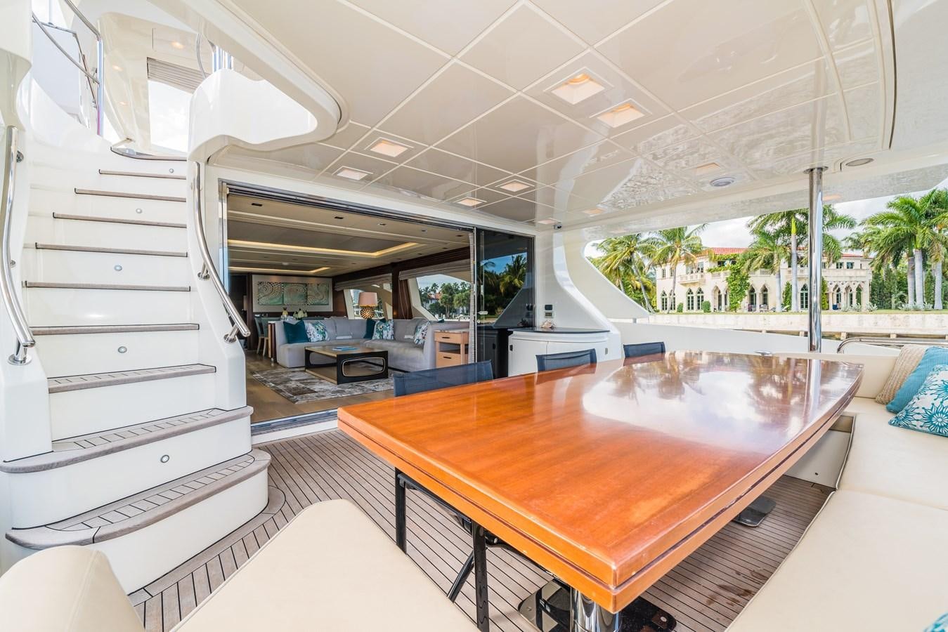 a large room with a table and chairs aboard SEA HACK Yacht for Sale