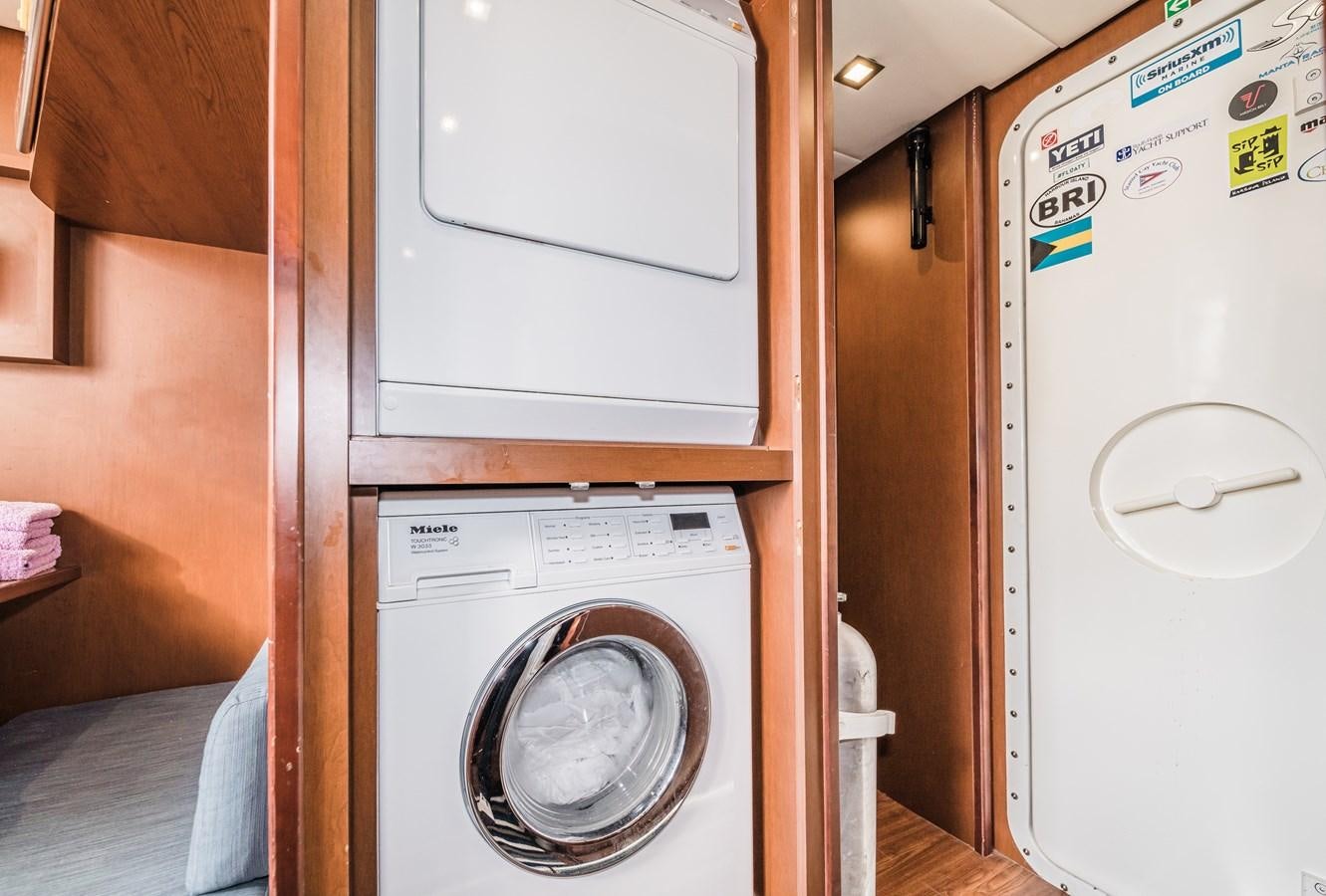 a washing machine in a room aboard SEA HACK Yacht for Sale