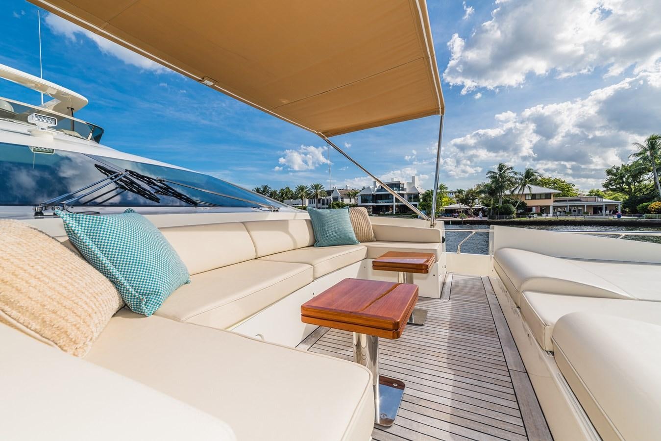 a lounge area with a table and chairs on it aboard SEA HACK Yacht for Sale
